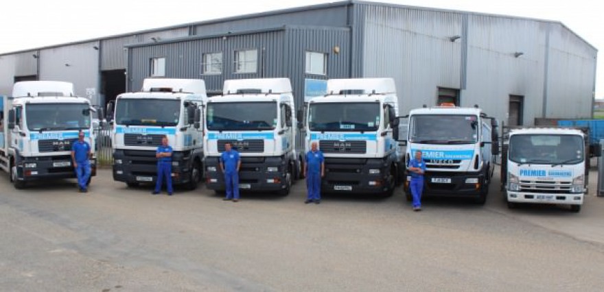 Five new trucks lined up with staff